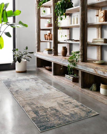 Dressed in refined ivory and soft misty hues with contemporary detail, the Teagan TEA-08 Ivory / Mist Area Rug is a power-loomed polypropylene and polyester area rug that completes any room