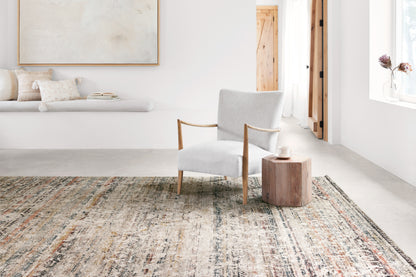 The Theia THE-03 Taupe / Multi Area Rug is a power-loomed polyester pile and rayon area rug that radiates versatile taupe and vibrant multi-toned charm