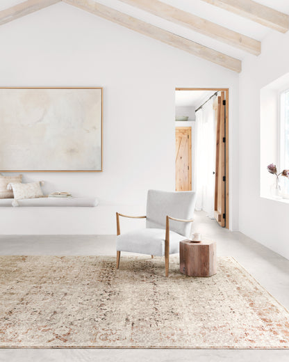 A power-loomed polyester pile and rayon area rug in warm natural and warm rust tones, the Theia THE-07 Natural / Rust Area Rug anchors any room