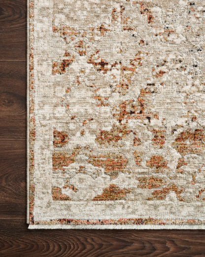 A power-loomed polyester pile and rayon area rug in warm natural and warm rust tones, the Theia THE-07 Natural / Rust Area Rug anchors any room