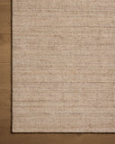 The Thorne THT-01 Sand Area Rug combines sandy tones with a hand-loomed polyester area rug for effortless elegance
