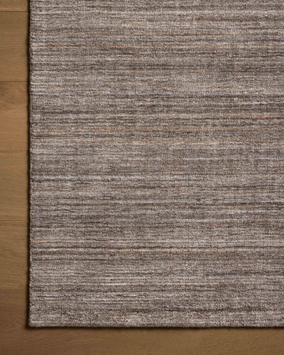 A hand-loomed polyester area rug with grounding stone tones, the Thorne THT-01 Stone Area Rug adds character to any room