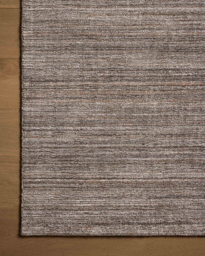 A hand-loomed polyester area rug with grounding stone tones, the Thorne THT-01 Stone Area Rug adds character to any room
