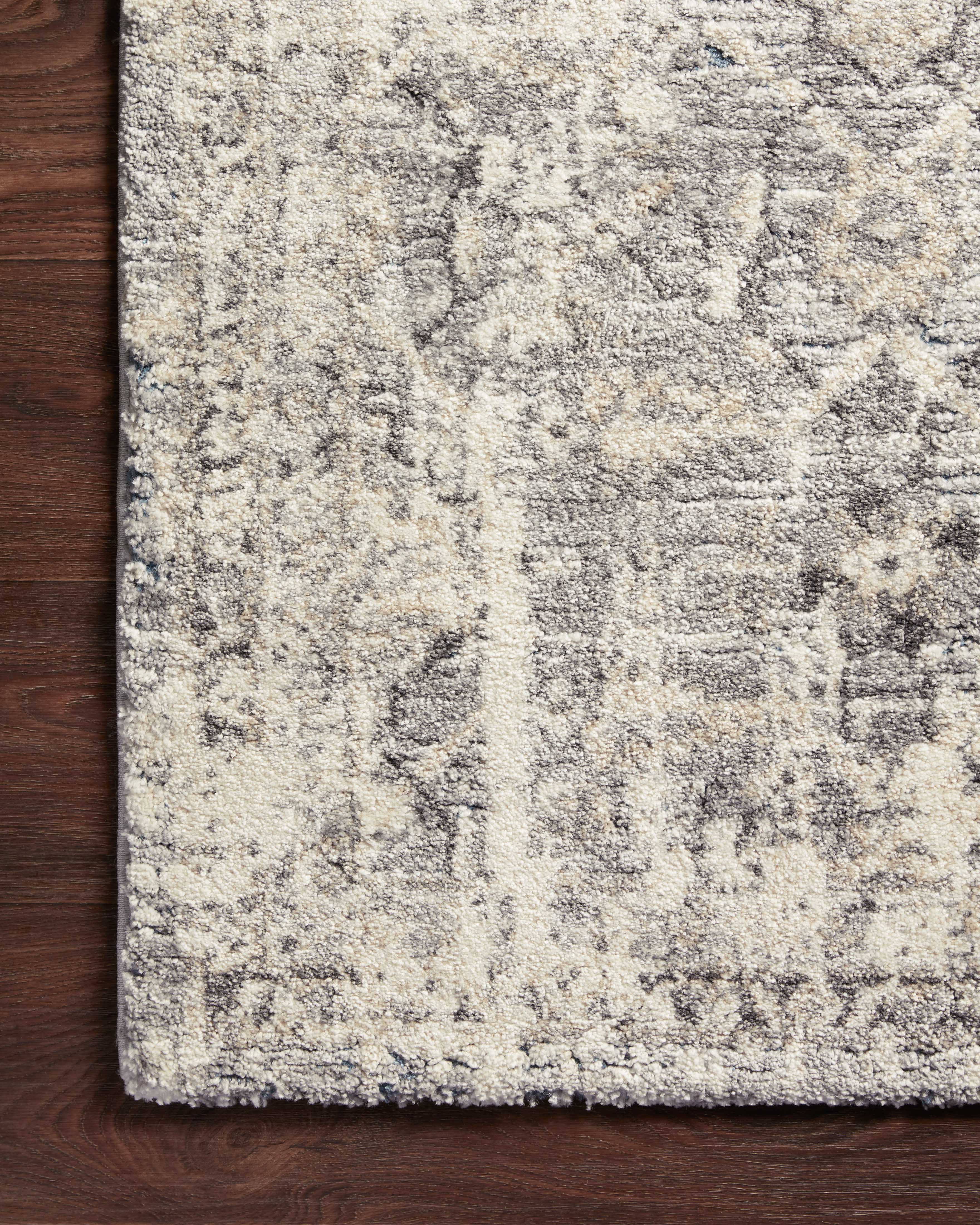 The Theory THY-03 Natural / Grey Area Rug blends warm natural and elegant grey tones and transitional motifs into a power-loomed polypropylene and polyester area rug with timeless appeal