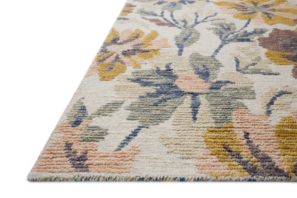 Crafted as a hand-tufted wool area rug, the Tilly TIL-03 Bone / Multi Area Rug brings bone and vibrant multi-toned warmth and floral and high-low textured character to your space