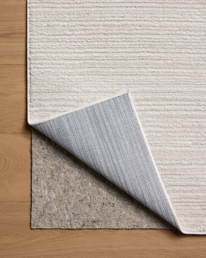 The Townes TOW-02 Beige / Ivory Area Rug delivers warm beige and refined ivory beauty and abstract elegance in a power-loomed polyester area rug