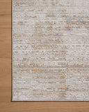 Designed with abstract artistry in sandy and warm beige hues, the Townes TOW-03 Sand / Beige Area Rug is a power-loomed polyester area rug that stands out