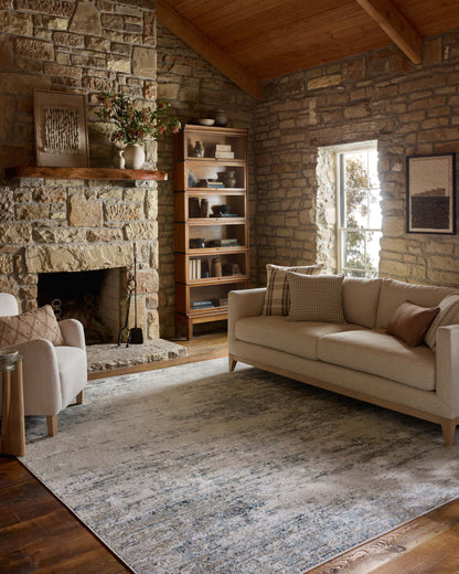 The Townes TOW-04 Ivory / Sky Area Rug combines refined ivory and breezy sky-blue tones and abstract patterns in a power-loomed polyester area rug for effortless elegance