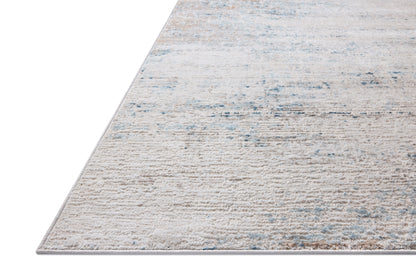 The Townes TOW-04 Ivory / Sky Area Rug combines refined ivory and breezy sky-blue tones and abstract patterns in a power-loomed polyester area rug for effortless elegance