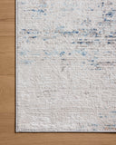 The Townes TOW-04 Ivory / Sky Area Rug combines refined ivory and breezy sky-blue tones and abstract patterns in a power-loomed polyester area rug for effortless elegance