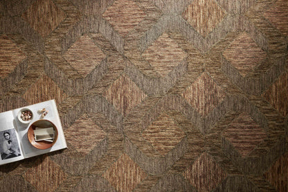 Finished in warm rust and grounded bark tones with graphic styling, the Varena VAR-03 Rust / Bark Area Rug is a hand-tufted 100% wool area rug for modern living