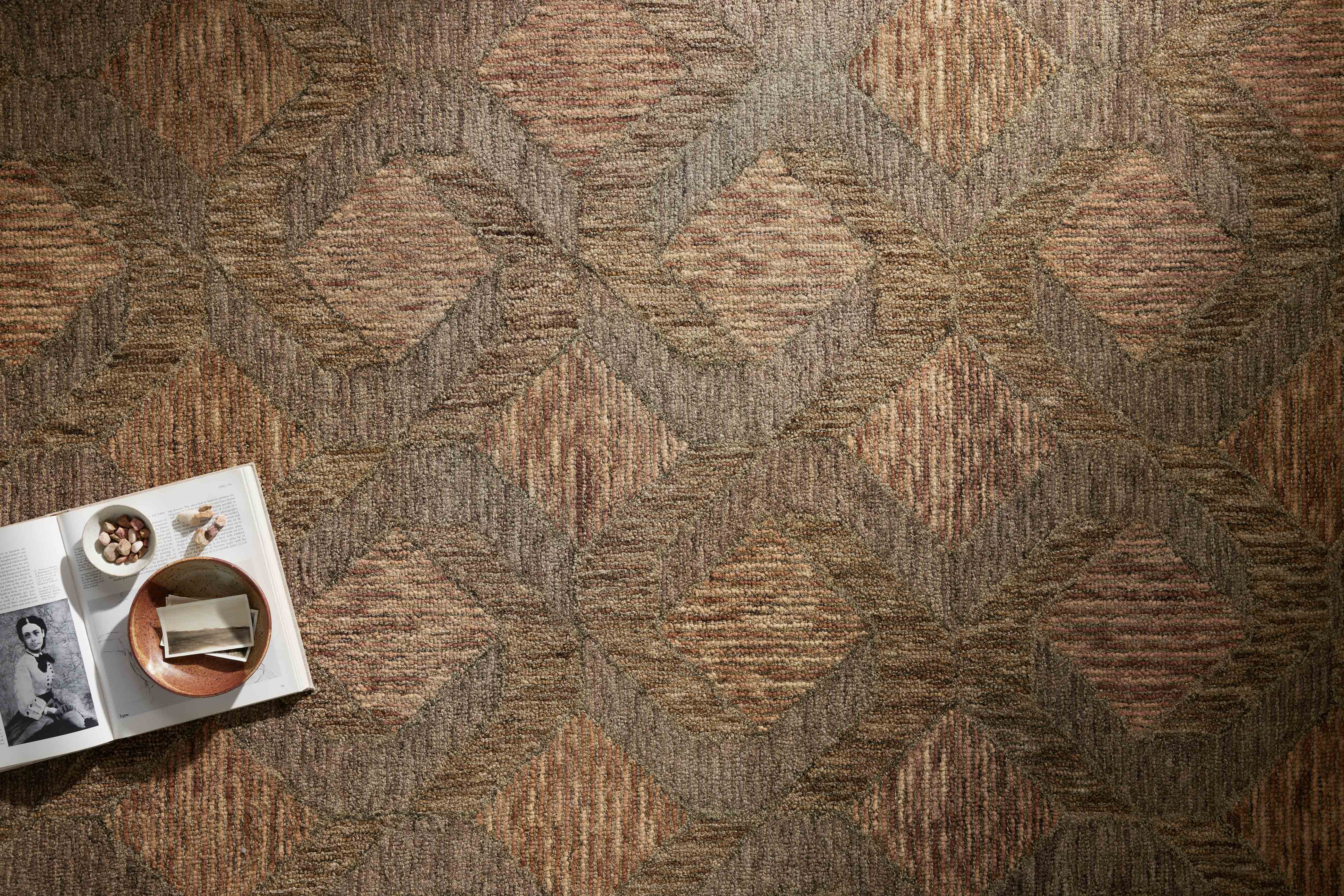 Finished in warm rust and grounded bark tones with graphic styling, the Varena VAR-03 Rust / Bark Area Rug is a hand-tufted 100% wool area rug for modern living