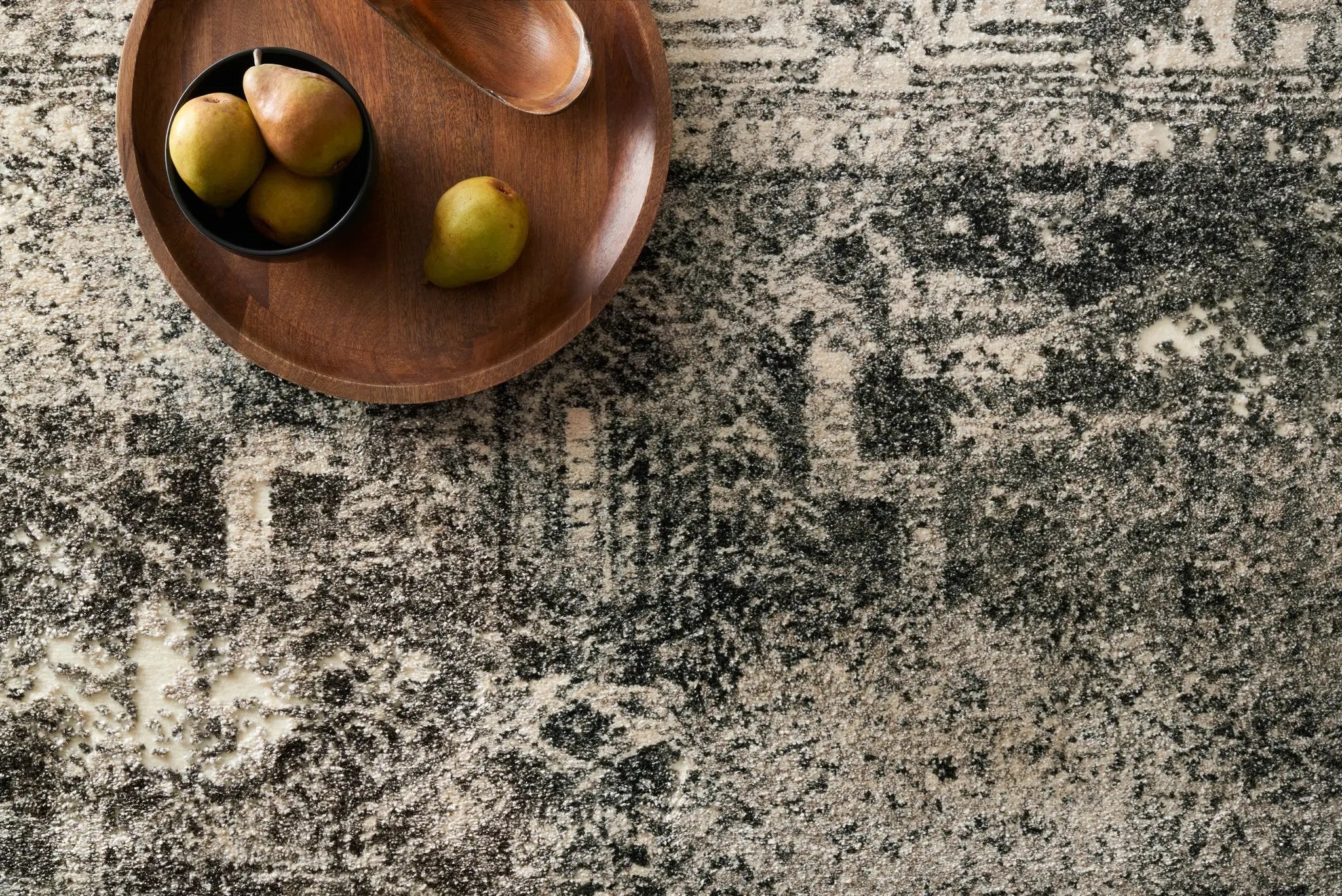 The Viera VR-03 Ash Area Rug highlights modern ash tones and contemporary and vintage texture in a beautifully made power-loomed polypropylene and polyester area rug