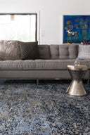 A power-loomed polypropylene and polyester area rug in elegant grey and classic navy tones with contemporary and vintage motifs, the Viera VR-07 Grey / Navy Area Rug grounds your room beautifully