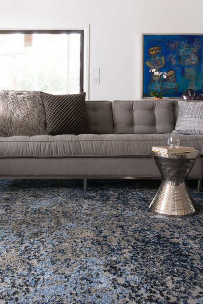 A power-loomed polypropylene and polyester area rug in elegant grey and classic navy tones with contemporary and vintage motifs, the Viera VR-07 Grey / Navy Area Rug grounds your room beautifully