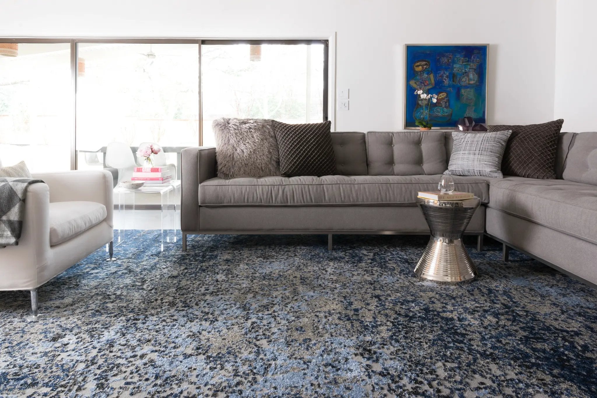A power-loomed polypropylene and polyester area rug in elegant grey and classic navy tones with contemporary and vintage motifs, the Viera VR-07 Grey / Navy Area Rug grounds your room beautifully