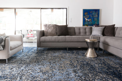 A power-loomed polypropylene and polyester area rug in elegant grey and classic navy tones with contemporary and vintage motifs, the Viera VR-07 Grey / Navy Area Rug grounds your room beautifully