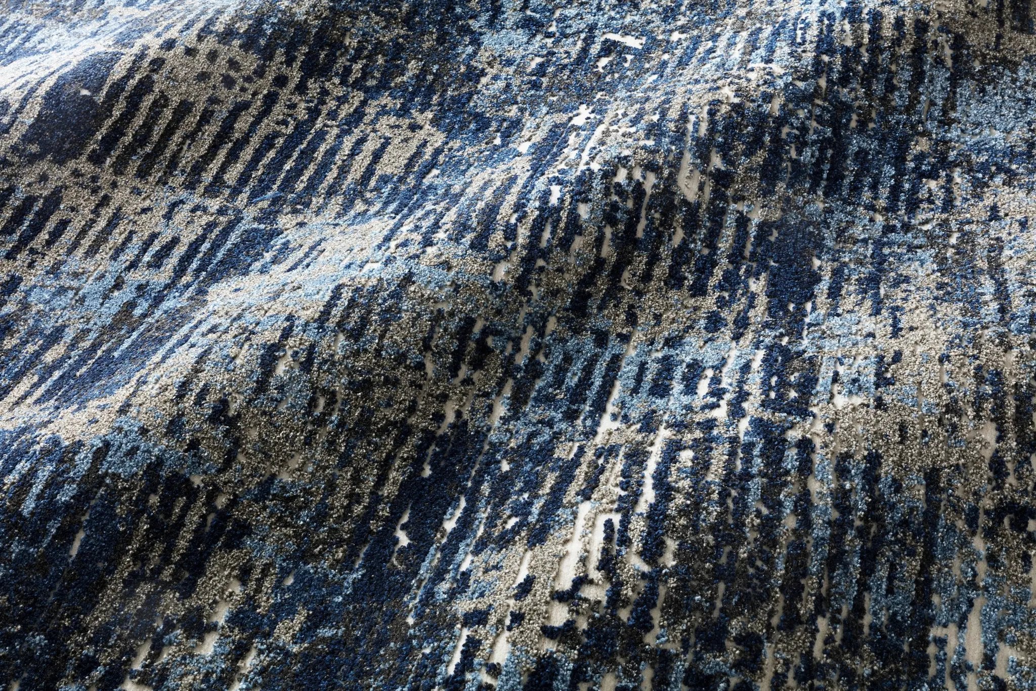 Layered in dark blue and elegant grey hues with contemporary and vintage patterns, the Viera VR-09 Dark Blue / Grey Area Rug is a power-loomed polypropylene and polyester area rug perfect for any setting