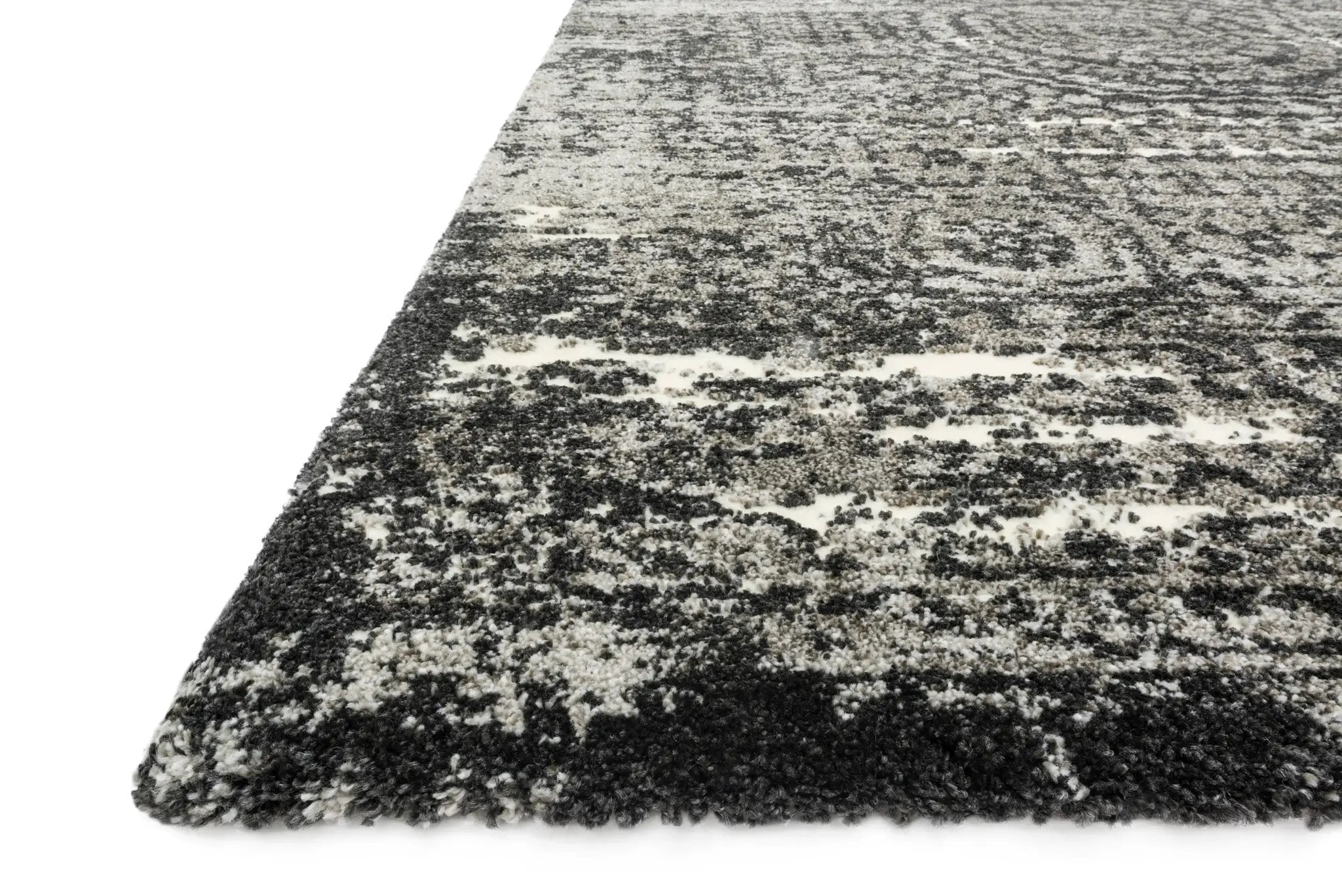 Featuring graphite and dramatic black hues and contemporary and vintage detail, the Viera VR-11 Graphite / Black Area Rug is a power-loomed polypropylene and polyester area rug for any room