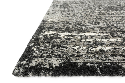 Featuring graphite and dramatic black hues and contemporary and vintage detail, the Viera VR-11 Graphite / Black Area Rug is a power-loomed polypropylene and polyester area rug for any room