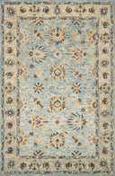 The Victoria VK-18 Lt. Blue / Natural Area Rug highlights light blue and warm natural tones and traditional texture in a beautifully made hooked 100% wool area rug