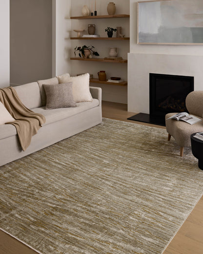Featuring calming sage and radiant gold hues and abstract and linear detail, the Wade WAE-01 Sage / Gold Area Rug is a power-loomed 100% polyester area rug for any room