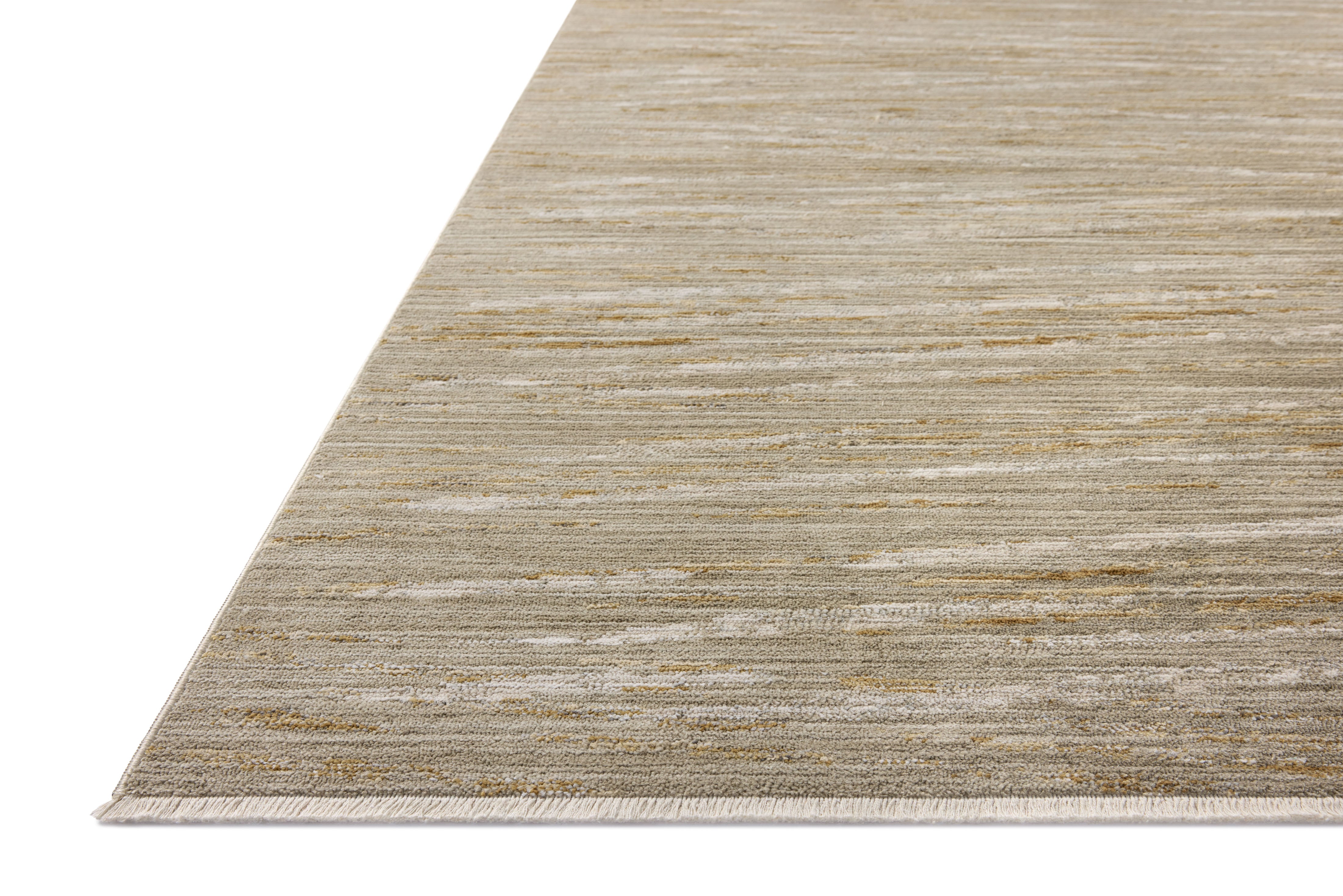 Featuring calming sage and radiant gold hues and abstract and linear detail, the Wade WAE-01 Sage / Gold Area Rug is a power-loomed 100% polyester area rug for any room