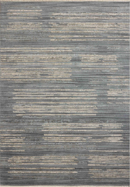 A power-loomed 100% polyester area rug with abstract and linear flair in serene ocean and sandy tones, the Wade WAE-02 Ocean / Sand Area Rug anchors any room