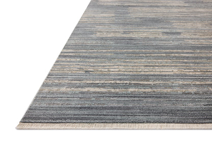 A power-loomed 100% polyester area rug with abstract and linear flair in serene ocean and sandy tones, the Wade WAE-02 Ocean / Sand Area Rug anchors any room