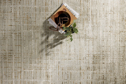 Crafted as a power-loomed 100% polyester area rug, the Wade WAE-03 Mist / Gold Area Rug brings soft misty and radiant gold warmth and abstract and linear character to your space