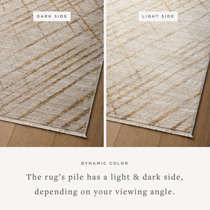 The Wade WAE-04 Beige / Gold Area Rug blends warm beige and radiant gold tones and abstract and linear motifs into a power-loomed 100% polyester area rug with timeless appeal