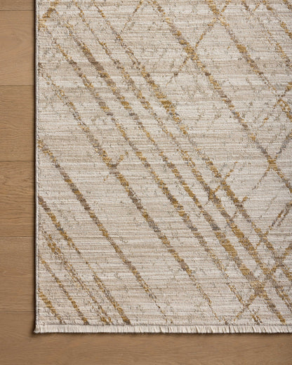 The Wade WAE-04 Beige / Gold Area Rug blends warm beige and radiant gold tones and abstract and linear motifs into a power-loomed 100% polyester area rug with timeless appeal