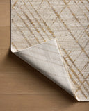 The Wade WAE-04 Beige / Gold Area Rug blends warm beige and radiant gold tones and abstract and linear motifs into a power-loomed 100% polyester area rug with timeless appeal