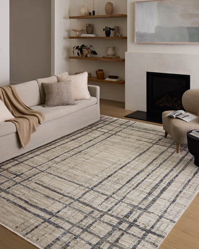 The Wade WAE-05 Beige / Midnight Area Rug delivers warm beige and dramatic midnight beauty and abstract and linear elegance in a power-loomed 100% polyester area rug
