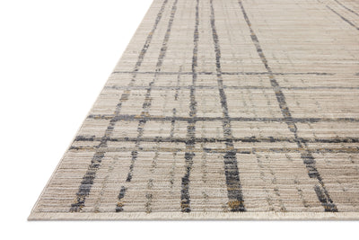 The Wade WAE-05 Beige / Midnight Area Rug delivers warm beige and dramatic midnight beauty and abstract and linear elegance in a power-loomed 100% polyester area rug