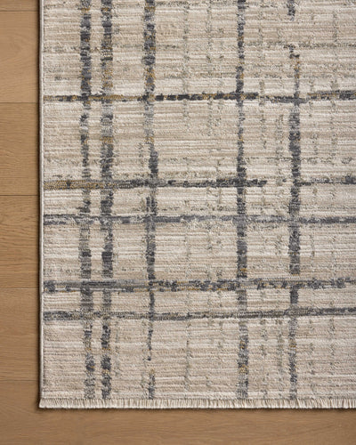 The Wade WAE-05 Beige / Midnight Area Rug delivers warm beige and dramatic midnight beauty and abstract and linear elegance in a power-loomed 100% polyester area rug