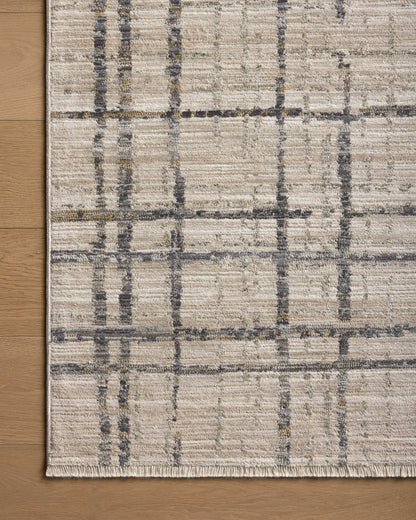 The Wade WAE-05 Beige / Midnight Area Rug delivers warm beige and dramatic midnight beauty and abstract and linear elegance in a power-loomed 100% polyester area rug