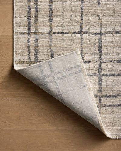 The Wade WAE-05 Beige / Midnight Area Rug delivers warm beige and dramatic midnight beauty and abstract and linear elegance in a power-loomed 100% polyester area rug