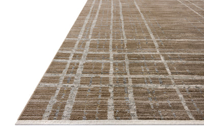 Designed with abstract and linear artistry in brown and grounding stone hues, the Wade WAE-05 Brown / Stone Area Rug is a power-loomed 100% polyester area rug that stands out