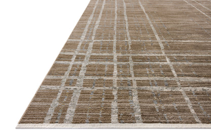 Designed with abstract and linear artistry in brown and grounding stone hues, the Wade WAE-05 Brown / Stone Area Rug is a power-loomed 100% polyester area rug that stands out