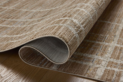 Designed with abstract and linear artistry in brown and grounding stone hues, the Wade WAE-05 Brown / Stone Area Rug is a power-loomed 100% polyester area rug that stands out
