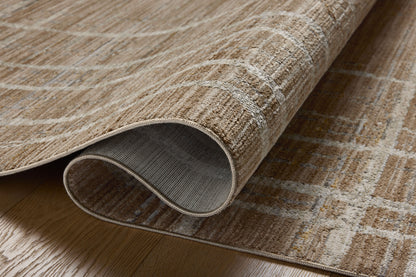 Designed with abstract and linear artistry in brown and grounding stone hues, the Wade WAE-05 Brown / Stone Area Rug is a power-loomed 100% polyester area rug that stands out