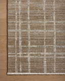 Designed with abstract and linear artistry in brown and grounding stone hues, the Wade WAE-05 Brown / Stone Area Rug is a power-loomed 100% polyester area rug that stands out