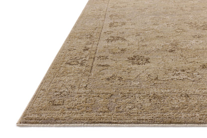 A power-loomed 100% polyester area rug featuring traditional and vintage design and versatile taupe and warm natural tones, the Willa WIA-02 Taupe / Natural Area Rug adds character to any room