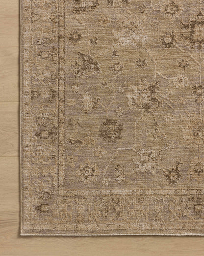 A power-loomed 100% polyester area rug featuring traditional and vintage design and versatile taupe and warm natural tones, the Willa WIA-02 Taupe / Natural Area Rug adds character to any room