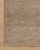 Dressed in grounding stone and vibrant multi-toned hues with traditional and vintage detail, the Willa WIA-10 Stone / Multi Area Rug is a power-loomed 100% polyester area rug that completes any room