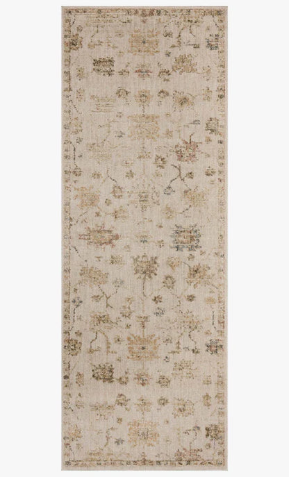 The Willa WIA-11 Bone / Multi Area Rug transforms any space with bone and vibrant multi-toned tones and traditional and vintage design in a power-loomed 100% polyester area rug