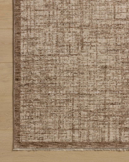 The Winston WIT-01 Earth / Bone Area Rug is a power-loomed polyester area rug that radiates earthy and bone charm