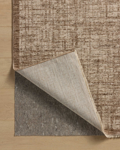 The Winston WIT-01 Earth / Bone Area Rug is a power-loomed polyester area rug that radiates earthy and bone charm