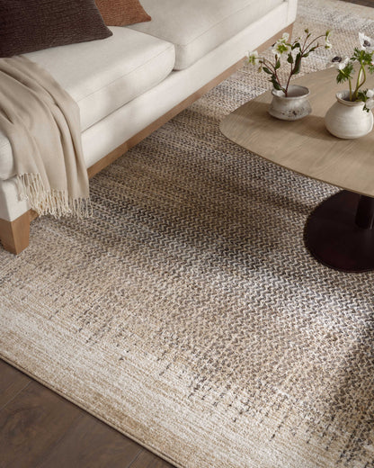 The Wyatt WYA-06 Stone / Beige Area Rug brings grounding stone and warm beige character and distressed flair to your home in a power-loomed polypropylene and polyester area rug